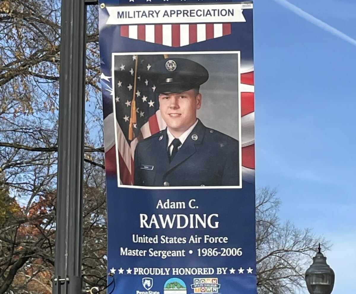 Military Appreciation banner in downtown State College honoring Adam C. Rawding, U.S. Air Force master sergeant, 1986-2006