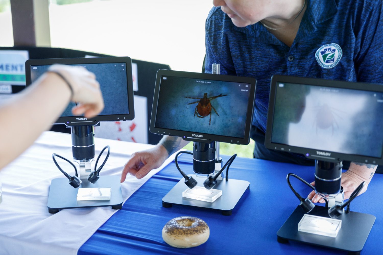 A screen displays a tick.